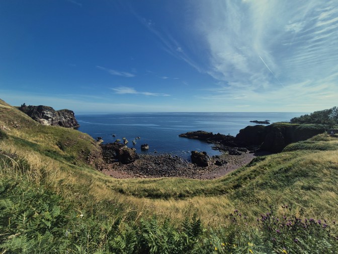 Views of the coast with rocky beach and blue skies