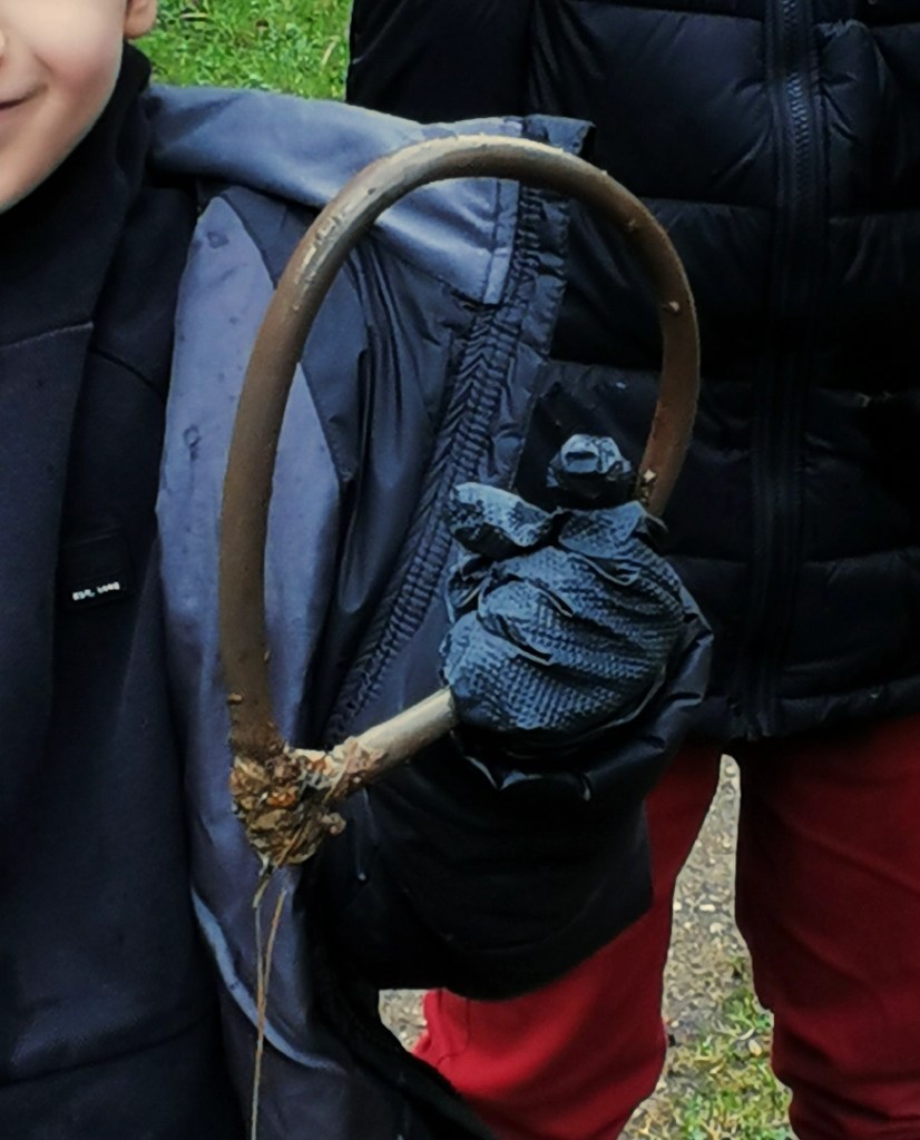 A mooring ring being held by a small child