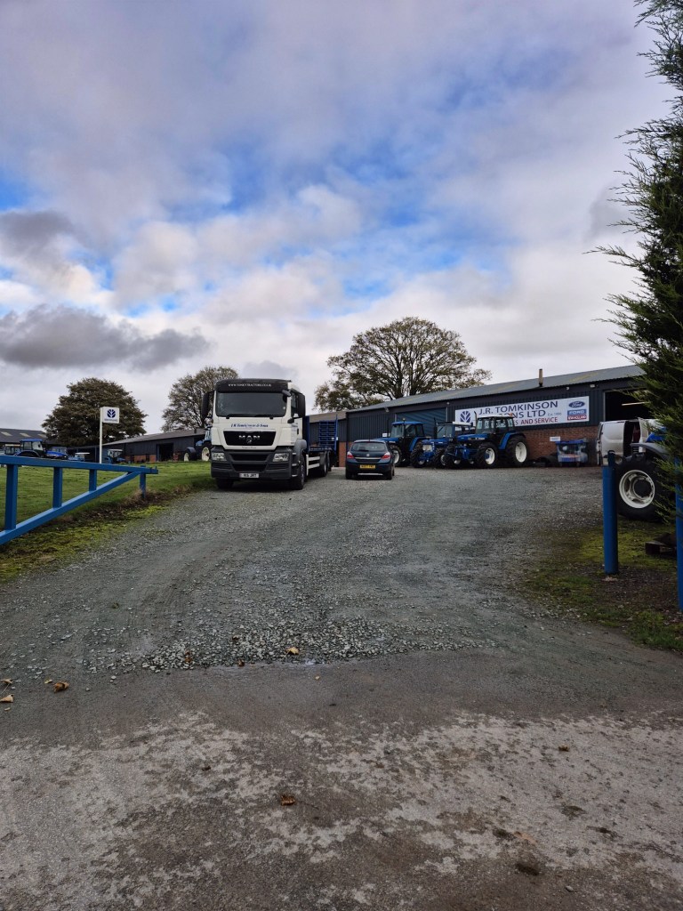 a view into a work year with several tractors and lorries