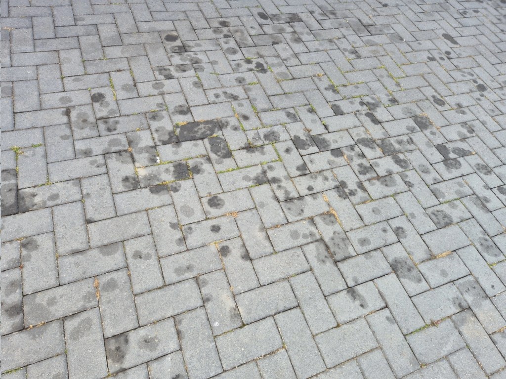 oil marks on a block pave driveway